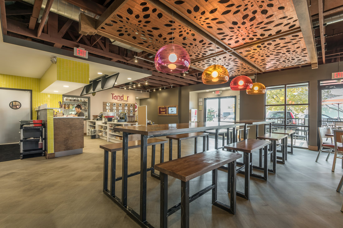 Dining Area with Over-Head Colored Lamps and Decorative Drop Ceiling at Tandur Indian Kitchen