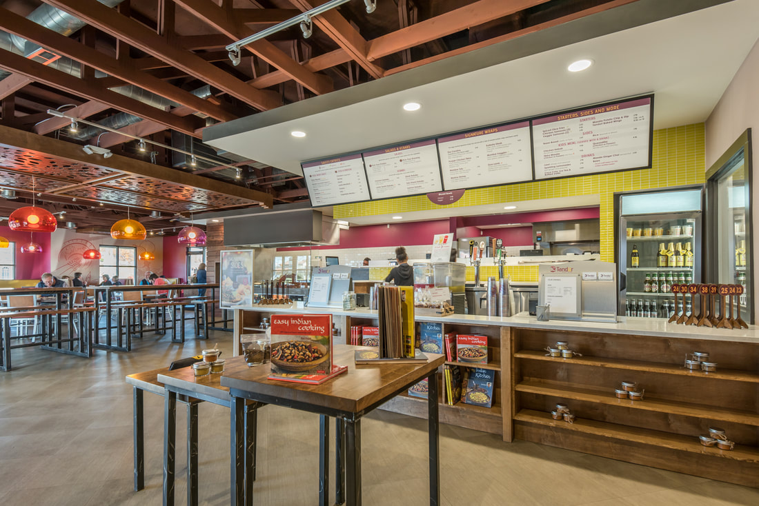 Ordering and Waiting Area with Exposed Trusses at Tandur Indian Kitchen