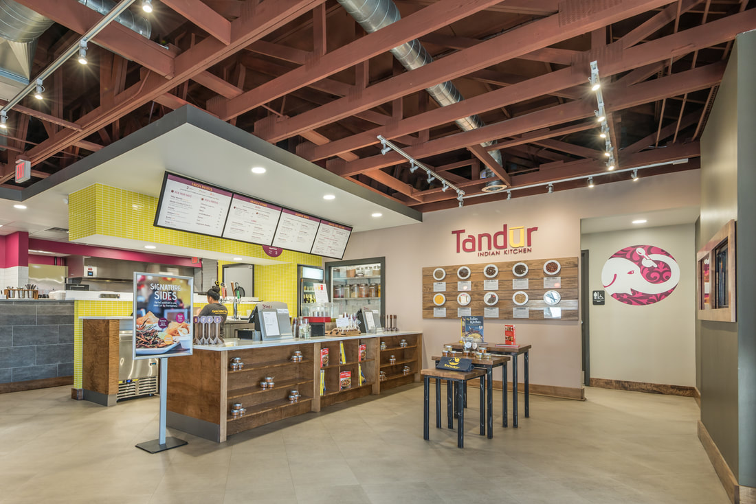 Ordering and Waiting Area with Exposed Trusses at Tandur Indian Kitchen