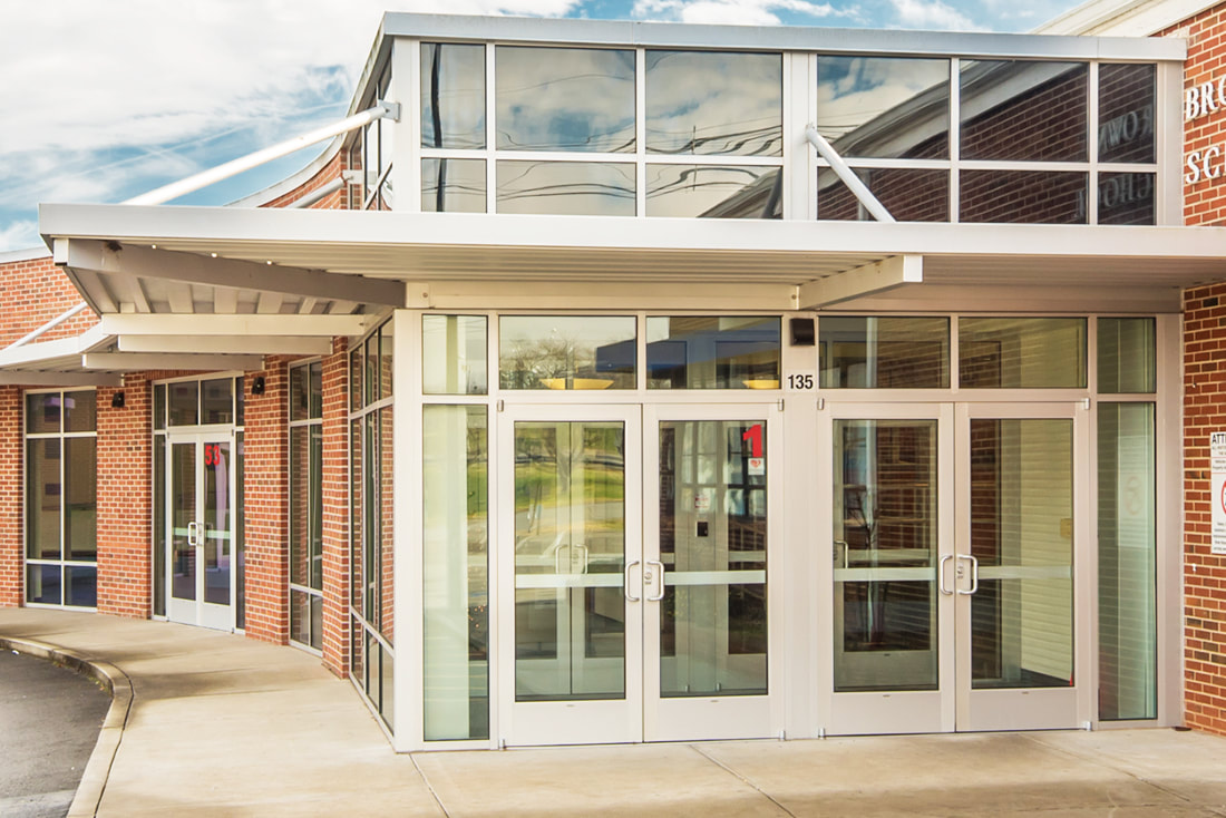 Renovation of Existing Breezeway into Enclosed Corridors and Entryways with Reimagined Administrative Offices