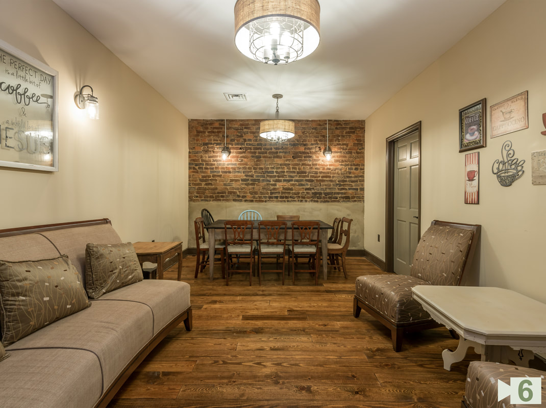 Finished Meeting Room with New DryWall New Floors and Existing Brick Wall