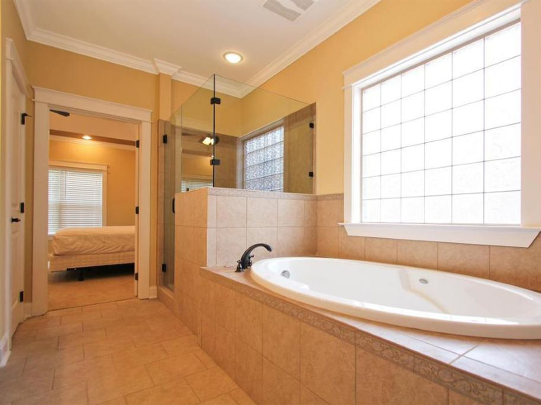 Master Bathroom with Tile Floors and Jacuzzi Tub