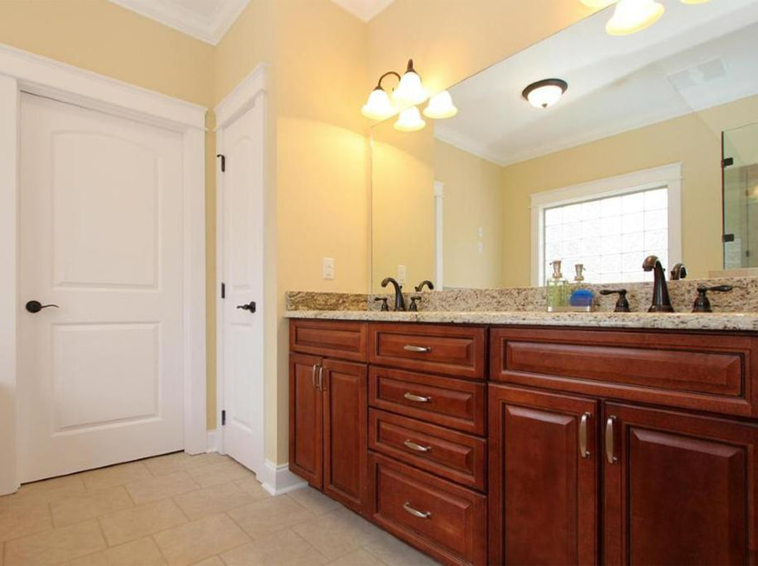 Master Bathroom with Double Sinks and Tile Floors
