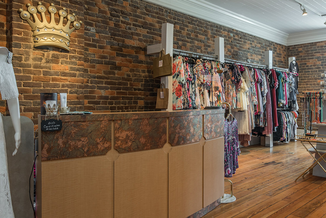 Historically Renovated Retail Space featuring Antique Wood Floors Original Brick Walls Tounge and Groove Wood Ceilings