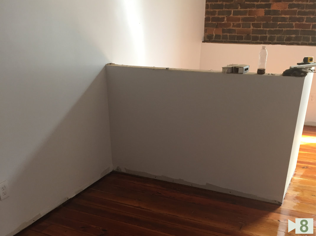 Reception Cubicle Framed with Polished Hard Wood Floor