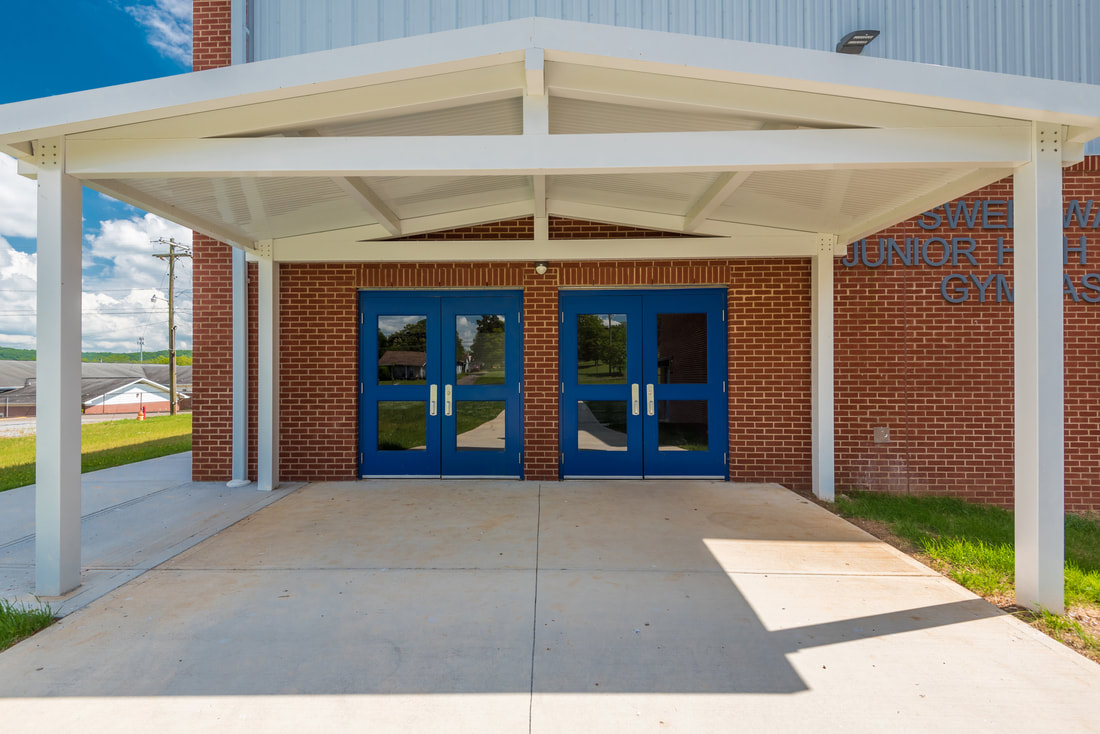 New Construction of Gymnasium and Basketball Court with Bathrooms, Dressing Rooms, and Spectator Seating